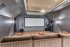 Cinema featuring a raised ceiling