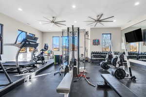 Workout area featuring ceiling fan and recessed lighting