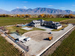 View of rural area featuring extensive farmland and mountains