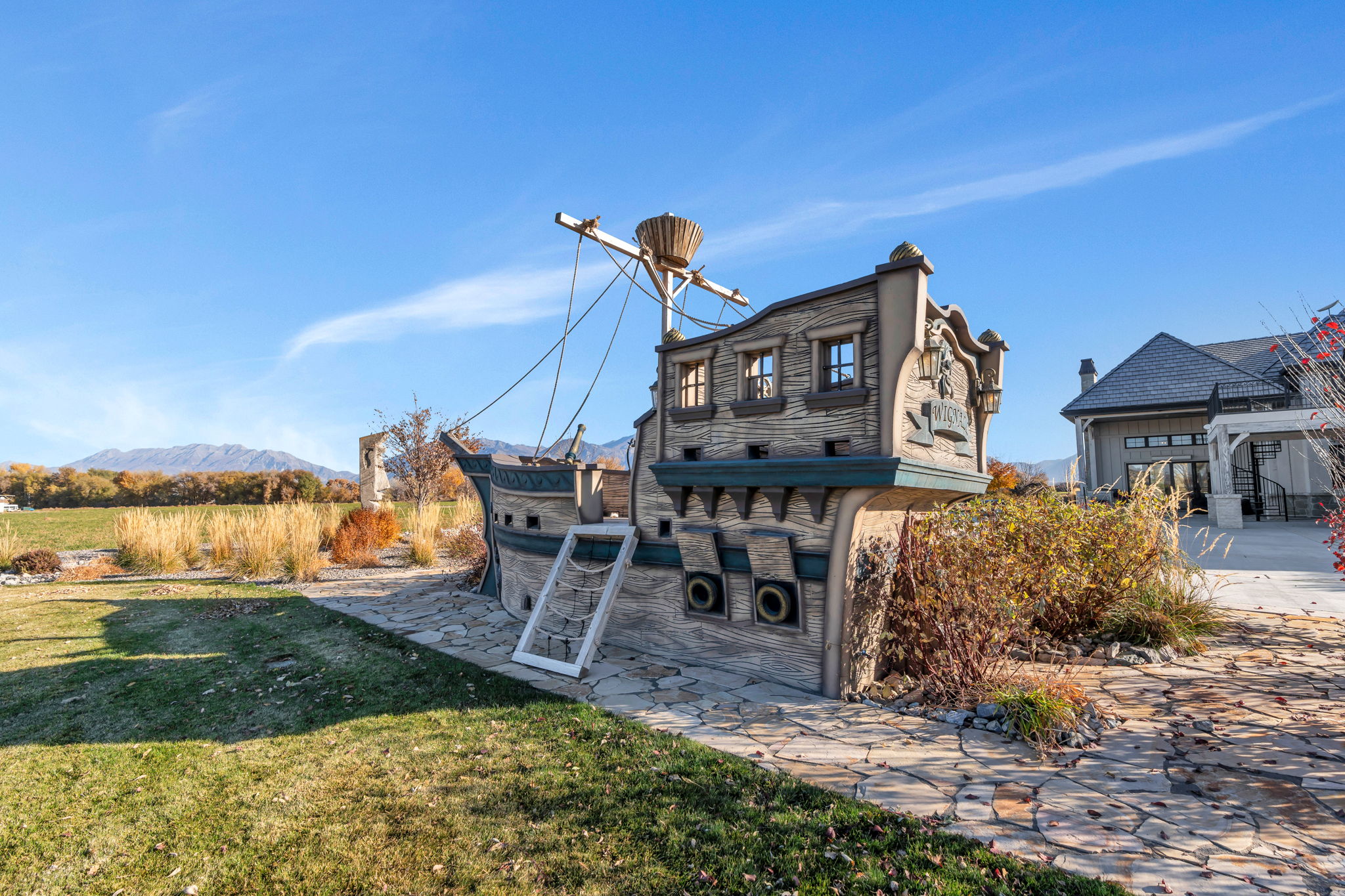 Rear view of property featuring a yard