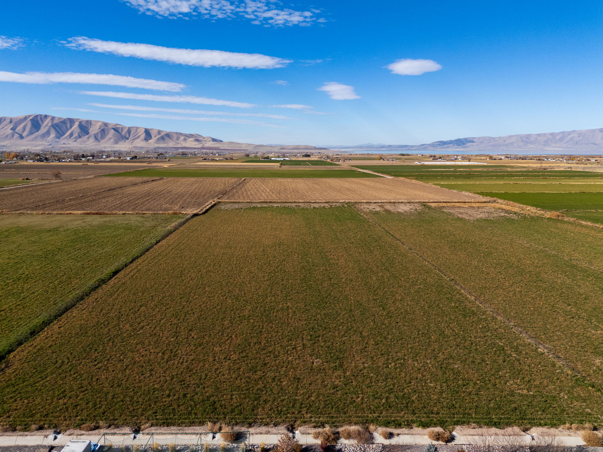 Overview of rural landscape with abundant farmland and a mountainous background
