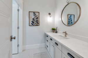 Bathroom featuring vanity and light tile patterned flooring