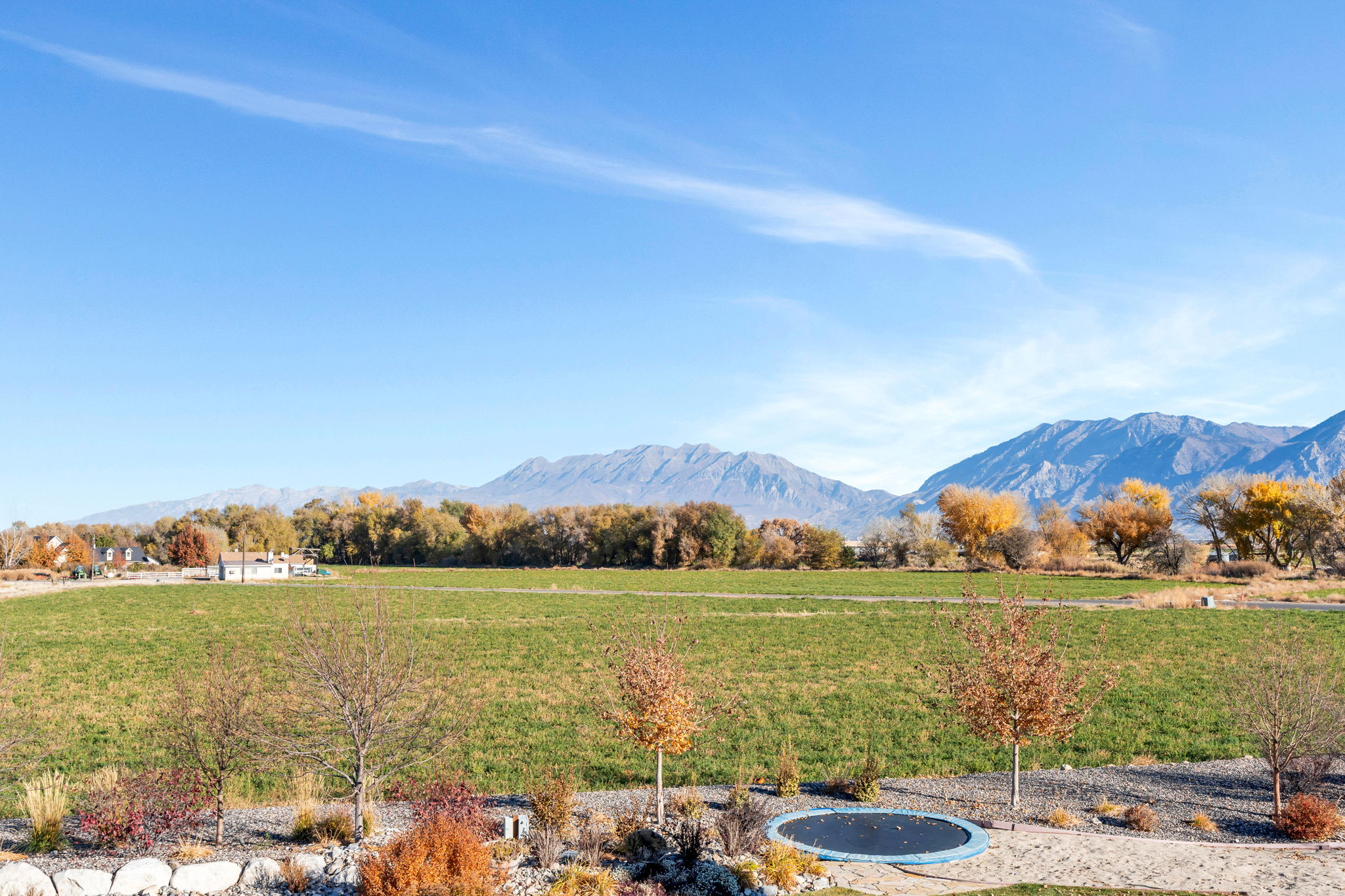 View of mountain backdrop with rural landscape
