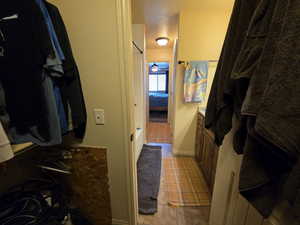 Spacious closet with light tile patterned floors