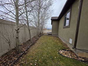 View of fenced backyard