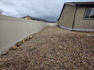 View of fenced backyard