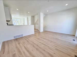 Living room walks out to a private deck and the sliders add a ton of natural light