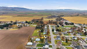 Aerial view of property's location featuring nearby suburban area and rural landscape