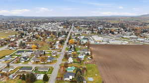 View of property location with a mountain backdrop and nearby suburban area