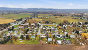 View of property location featuring nearby suburban area and mountains