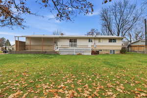 Back of property featuring a deck and a chimney