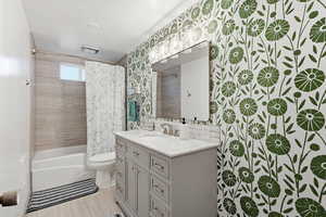 Full bathroom featuring vanity and shower / tub combo