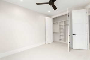 Unfurnished bedroom featuring light colored carpet, recessed lighting, a ceiling fan, and a closet