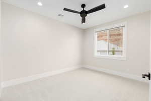 Unfurnished room with light carpet, recessed lighting, and a ceiling fan