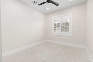 Empty room with light colored carpet, recessed lighting, and ceiling fan