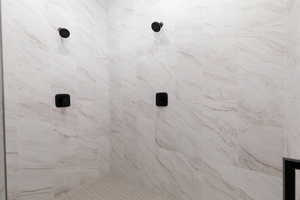 Full bath with tiled shower