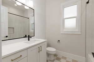 Bathroom with vanity and tile patterned floors