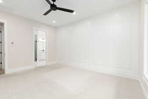 Unfurnished bedroom featuring light colored carpet, recessed lighting, ceiling fan, and ensuite bathroom