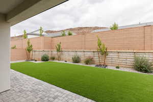 Fenced backyard featuring a patio