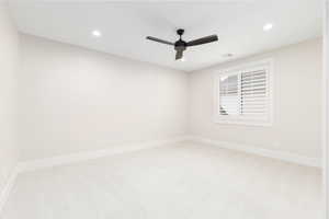 Unfurnished room featuring light carpet, recessed lighting, and ceiling fan