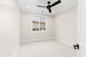 Unfurnished room featuring light colored carpet, recessed lighting, and ceiling fan