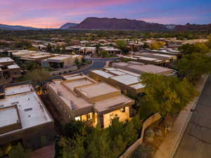 Aerial view of residential area featuring a mountain backdrop