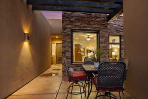 Dining area featuring beam ceiling and ceiling fan