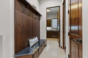 Mudroom featuring light tile patterned floors