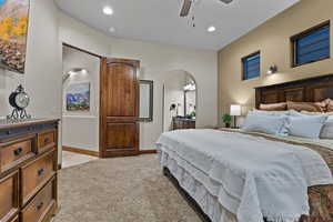 Bedroom featuring light colored carpet, recessed lighting, and ceiling fan