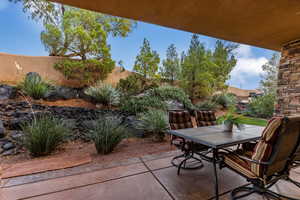 Fenced backyard with a patio and outdoor dining space