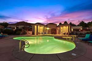 View of swimming pool with a patio area, an outdoor structure, a storage structure, and a mountain view