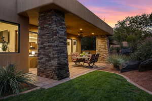 View of patio featuring a ceiling fan and outdoor dining area