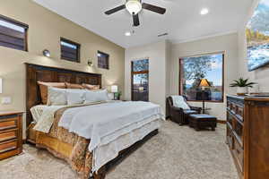Bedroom with multiple windows, light colored carpet, ceiling fan, and recessed lighting