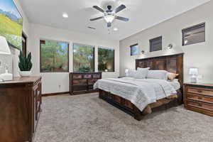 Bedroom featuring light colored carpet, recessed lighting, and a ceiling fan