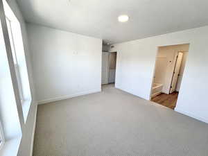 Primary bedroom suite with walk-in closet and private bathroom attached