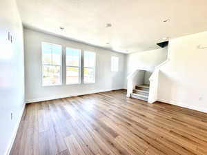 Natural light floods the room with its large windows