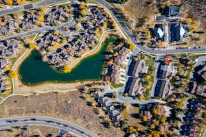 Aerial view of property's location featuring nearby suburban area and a large body of water