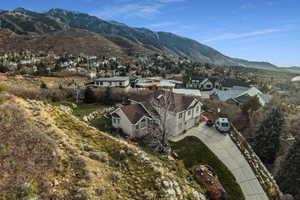 Aerial view of residential area featuring a mountainous background