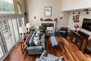 Living area featuring a fireplace and wood finished floors