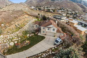 View of property location featuring mountains and nearby suburban area