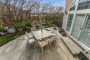 View of patio with outdoor dining area