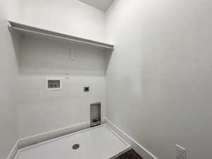 Laundry room with hookup for a washing machine and electric dryer hookup