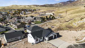 Aerial perspective of suburban area with a mountain backdrop