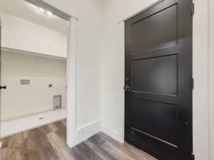 Entrance foyer with wood finished floors and baseboards