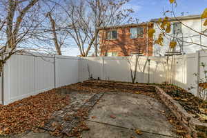 Fenced backyard with a patio area