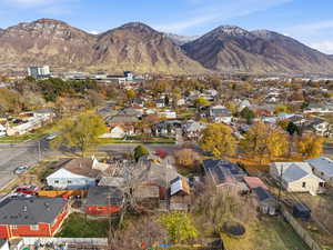 View of property location featuring a mountain backdrop and nearby suburban area