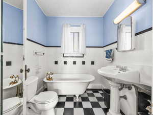 Bathroom featuring a freestanding tub and tile patterned floors
