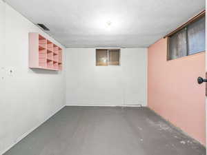 Finished below grade area with a textured ceiling