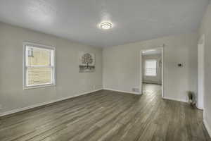 Unfurnished room featuring baseboards and light wood-style floors