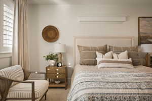 Carpeted bedroom with baseboards